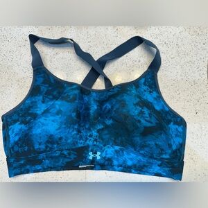 Two bras: Under Armour Women's Blue Sports Bra and white sports bra (L)